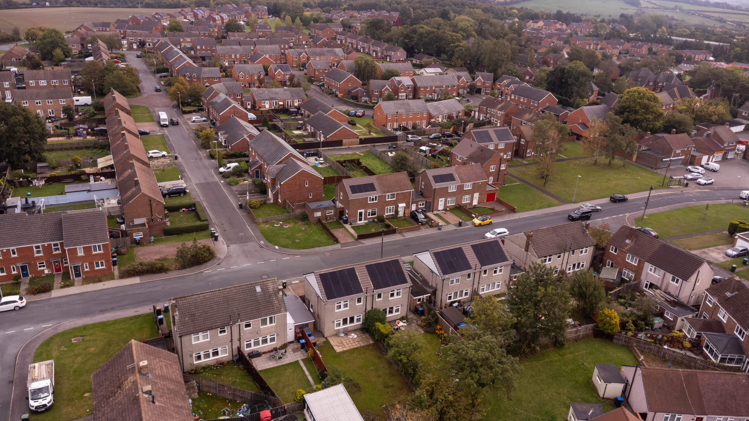 Aerial shot of homes showing PV on roofs